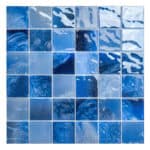 Vivid blue glass mosaic tiles with glossy finish, textured surface, and artistic abstract pattern.