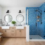 Blue mosaic tile shower wall with textured surface and sleek black fixtures.