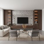Gray brick wall with textured surface behind a mounted flat-screen TV.