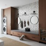 Gray brick wall tile with textured surface and modern round mirrors.