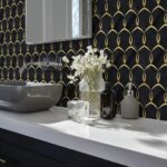 Elegant black tile with gold geometric pattern, textured surface, and sleek design.