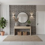 Stone tile wall with textured, natural gray tones, complemented by a sleek beige console table and decorative accents.