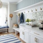 Blue and white mosaic tile backsplash in a bright entryway.