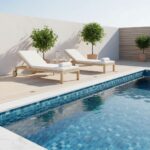 Poolside lounge area with wooden sunbeds and potted trees.