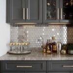 Hexagon white marble tile with subtle gray veining, smooth texture, used as a kitchen backsplash.