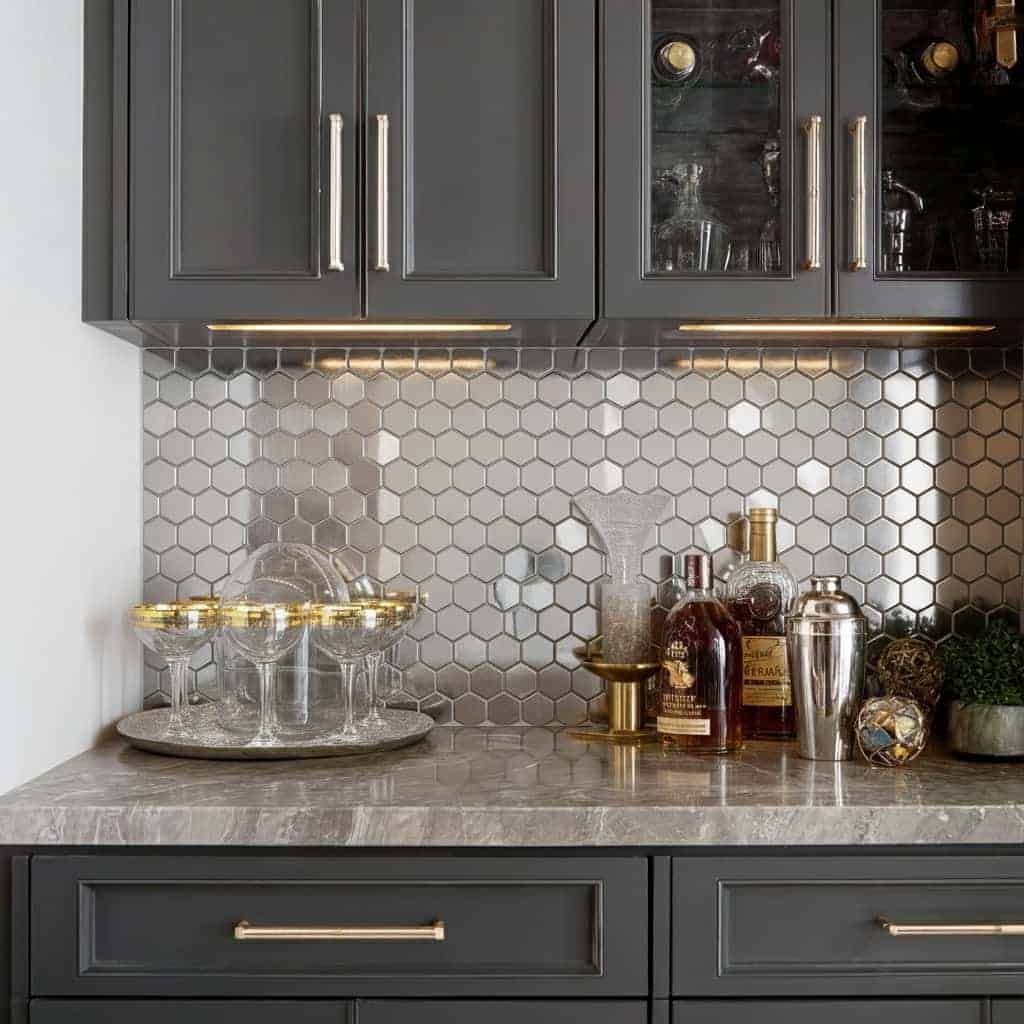 Hexagon white marble tile with subtle gray veining, smooth texture, used as a kitchen backsplash.