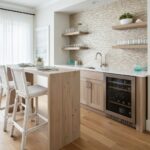 Beige textured tile backsplash with a subtle pattern in a contemporary kitchen setting.