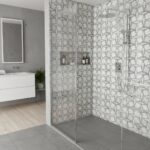 Gray geometric patterned ceramic tile in the shower area, with a textured surface and modern design.