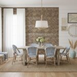 Brick wall with textured, earthy tones behind dining table.
