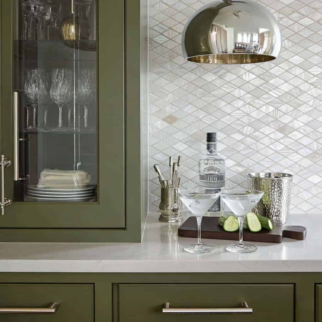 Green textured ceramic tile backsplash with a diamond pattern.