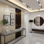 Beige mosaic tile wall with textured surface, complemented by dark wooden decorative panel, in a modern interior setting.