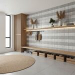 Bright, modern interior with white and gray tiled wall, wooden shelves, and decorative vases.