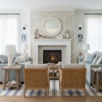 Light neutral textured stone tile with a natural finish around the fireplace, adding a cozy and elegant touch to the living r.