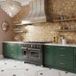 Bright green kitchen cabinets with gold handles and accents, complemented by a white marble countertop and a textured brick b.