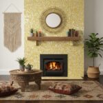 Warm yellow mosaic tile with small, glossy, irregularly shaped pieces creating a textured, vibrant backdrop.