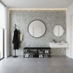 Neutral mosaic tile wall with textured surface and subtle color variations.