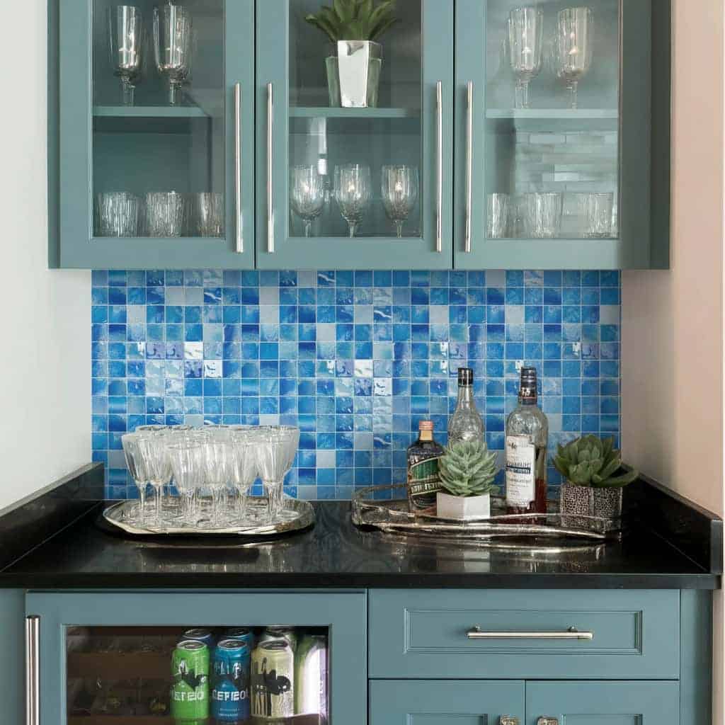 Bright blue mosaic tile backsplash with textured surface.