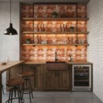 Geometric tile backsplash in warm terracotta tones, textured surface, with wooden shelves and bar stools.