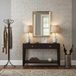 Cream and beige textured wallpaper with subtle geometric pattern.