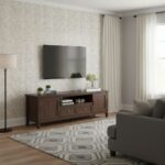 Beige textured wallpaper with subtle pattern, perfect for a cozy living room setting.