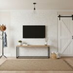 Modern white textured tile wall with a flat-screen TV.