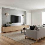 Gray textured wall tiles with a sleek black TV and minimalist decor.