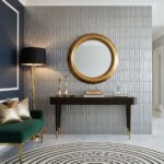 A close-up of a gray textured wall tile with a geometric pattern, used as an accent wall in a contemporary interior.