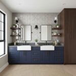 Navy blue tile with a textured surface, white ceramic sinks, and a neutral wall background.
