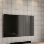 Beige ceramic tiles with smooth texture and subtle grout lines, creating a clean, contemporary look.