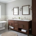 Bathroom vanity with wooden cabinet and marble countertop, modern design, neutral tones.