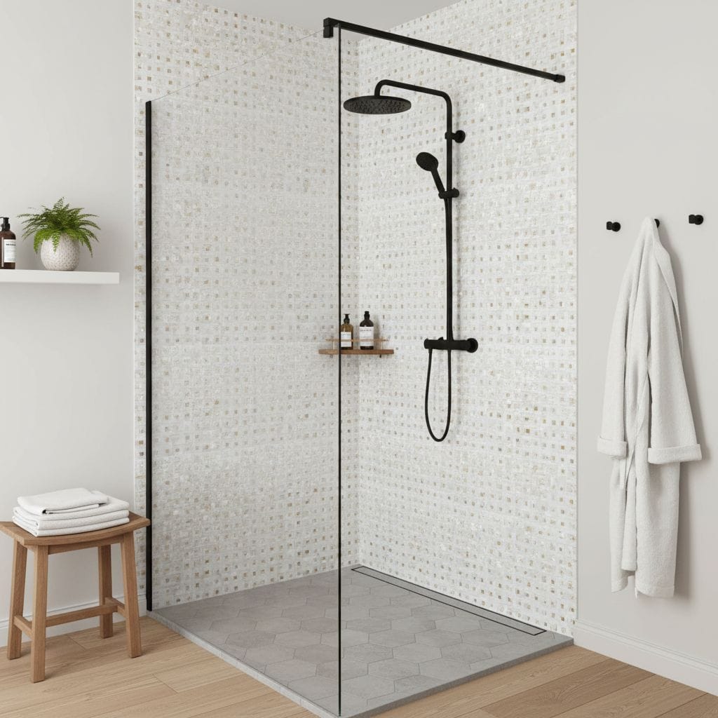 White mosaic tile with subtle beige accents, textured surface, modern black shower fixtures.