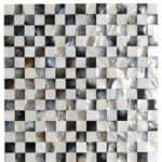 Shimmering mother of pearl mosaic tile with iridescent, smooth, and glossy surface in white, cream, and black shades.