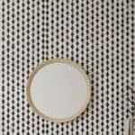 Black and white geometric tile with textured surface and glossy finish.