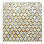 Shimmering mother of pearl tile with a geometric cube pattern in gold and white tones.