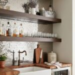 White subway tile backsplash with a glossy finish and textured surface.