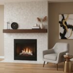 Close-up of white textured tile wall around fireplace, with cozy living room decor and abstract art.