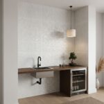 White mosaic tile backsplash with textured surface and glossy finish in contemporary kitchen.