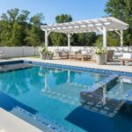 Blue ceramic pool tile with textured surface, perfect for outdoor swimming pools, adding a sleek and durable finish.