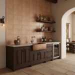 Rustic beige ceramic tile wall with textured surface, paired with dark wood kitchen cabinet and open wooden shelves, creating.