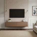 Beige textured tile wall with a black TV, wooden console, and abstract art.