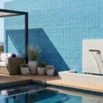 Blue mosaic tile with textured surface and glossy finish.