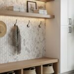 White marble-look tile with subtle gray veining, textured surface for slip resistance, installed on a wall.