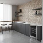 Beige mosaic tiles with textured surface on kitchen wall, paired with sleek gray cabinetry and minimalist black shelves, crea.