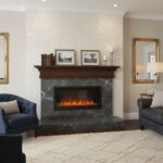 Elegant black marble fireplace with wooden mantel, white textured wall, and comfortable seating in a stylish living room.