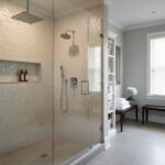 Bright, textured pebble tiles in beige and cream tones for shower walls, creating a natural, spa-like ambiance.