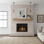 Light beige speckled tile with a smooth texture, used for the fireplace surround, creating a warm and inviting atmosphere.